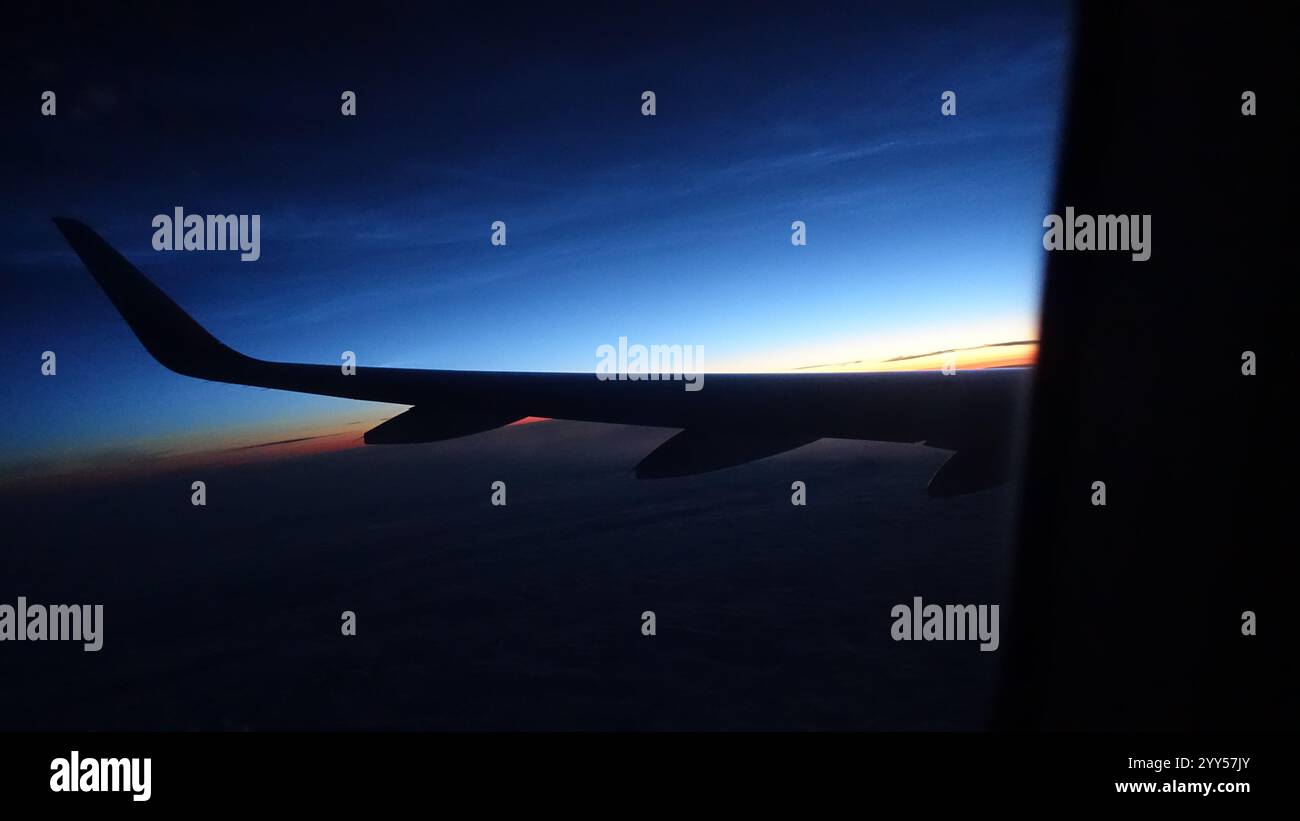 Airplane wing view during sunset hi-res stock photography and images ...