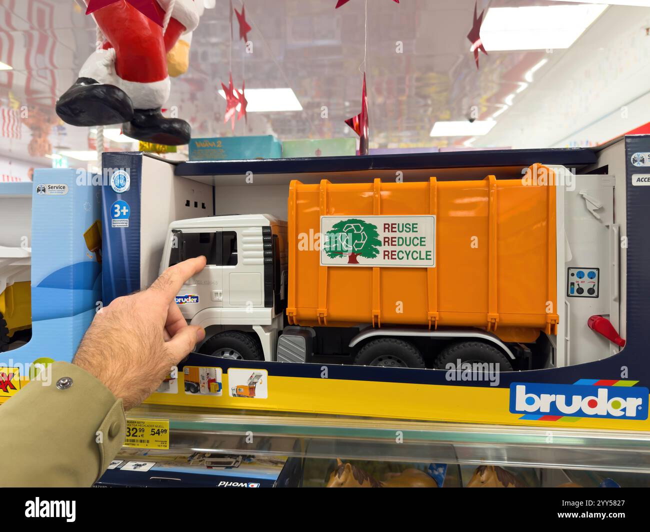 Berlin, Germany - Nov 22, 2024: toy garbage truck with Reuse Reduce ...