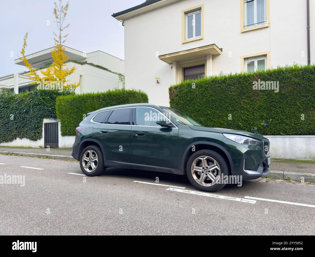 Paris, France - Oct 20, 2024: A dark green BMW luxury car parked on the ...
