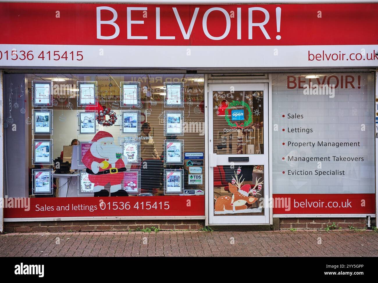 Belvoir estate agents shop at Kettering, England, on a wet winter day. Stock Photo