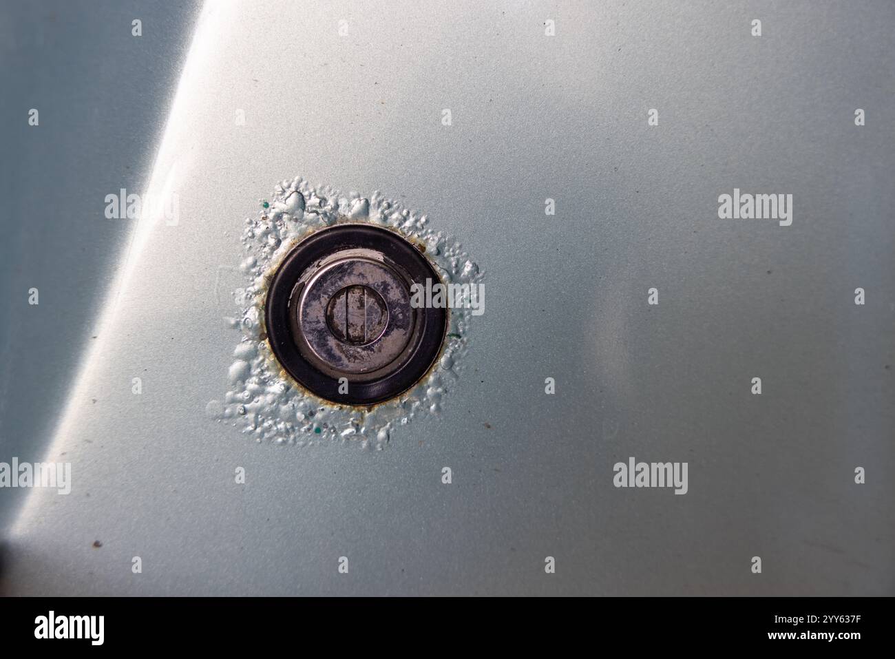 Rusty car. Corrosion around the lock. Stock Photo