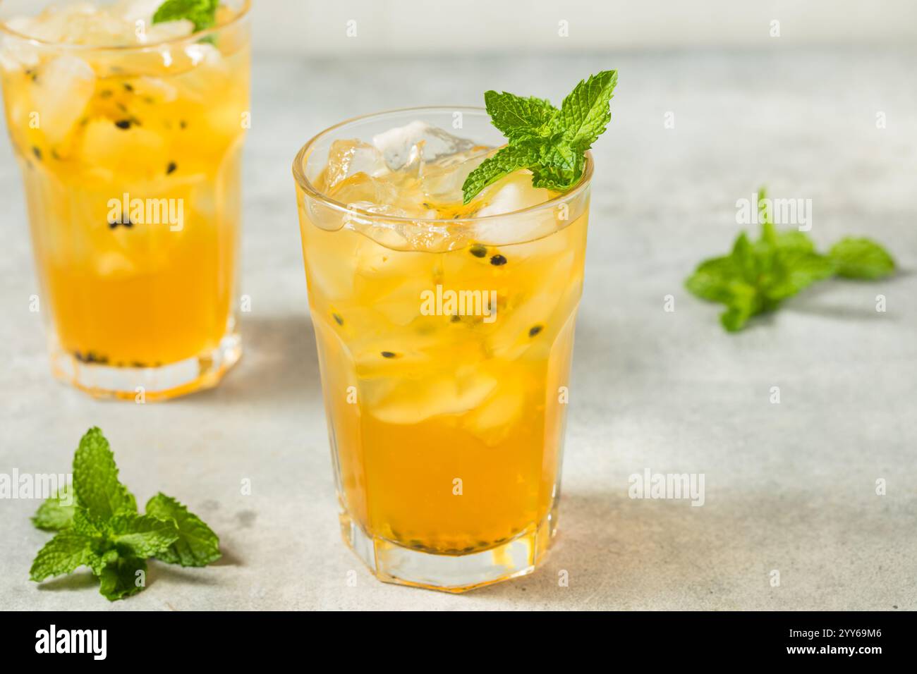 Cold Refreshing Passion Fruit Iced Tea with Mint Stock Photo