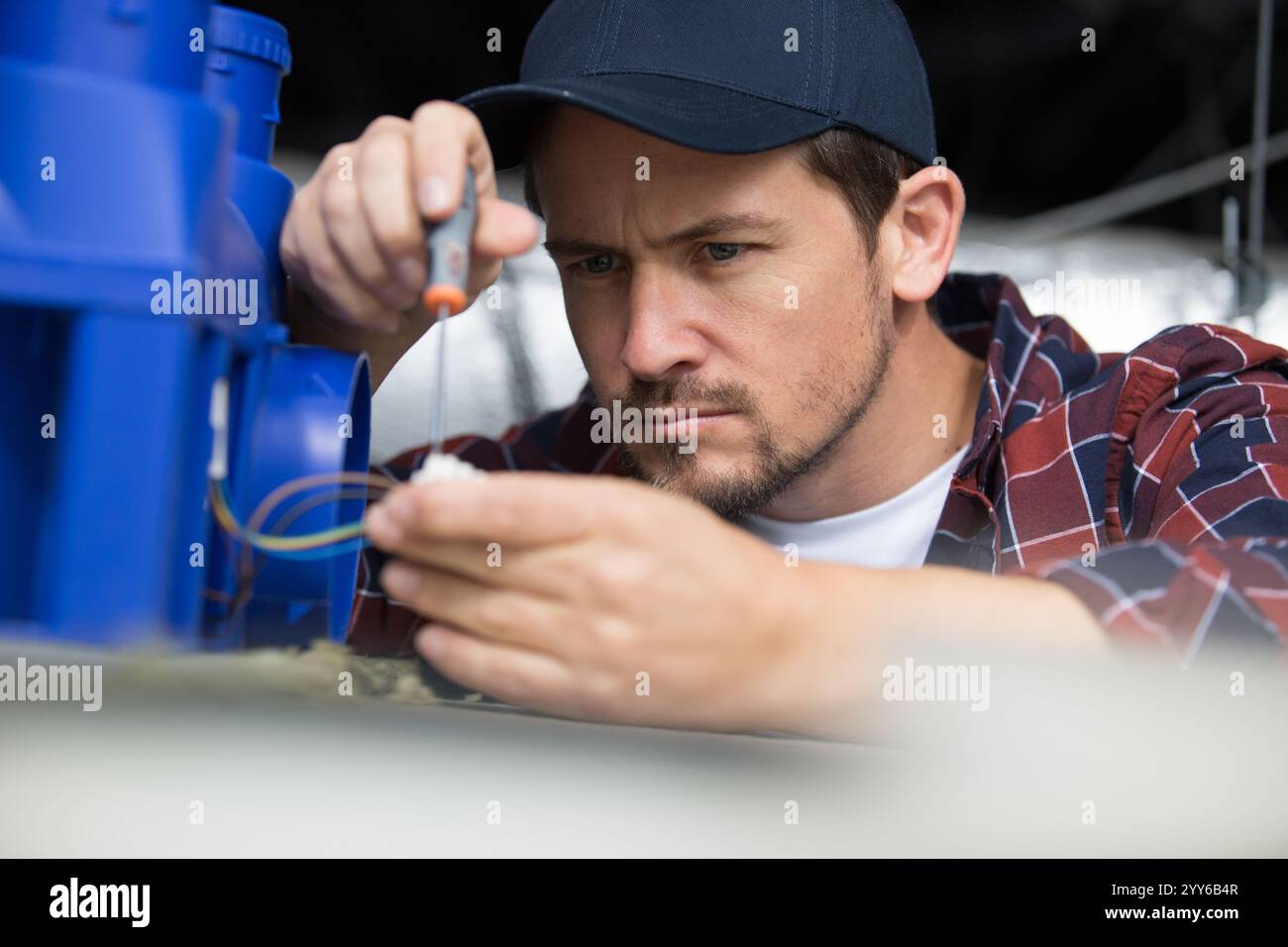 industrial engineer checks some joints of a robot Stock Photo