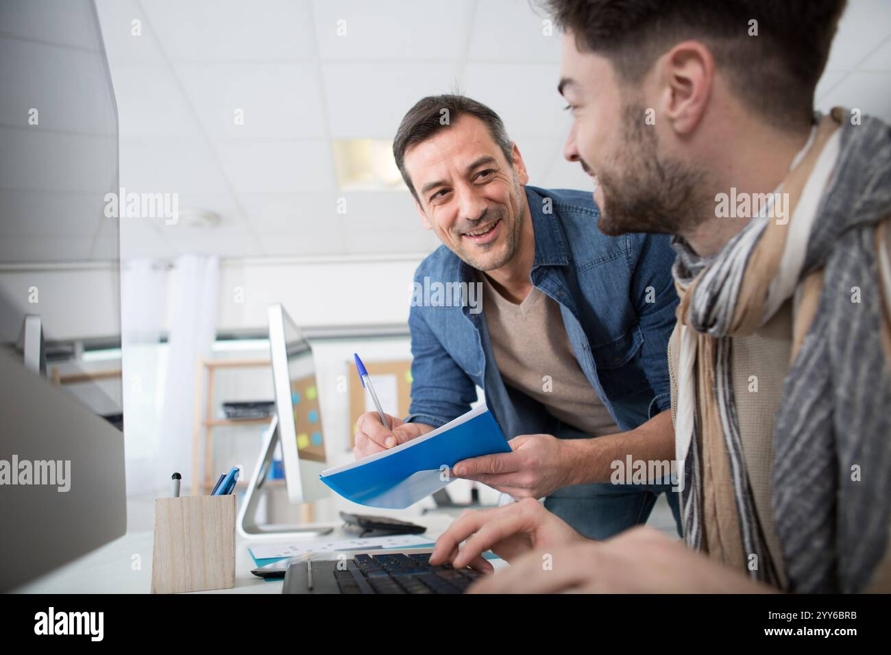 two happy architects working on the project Stock Photo