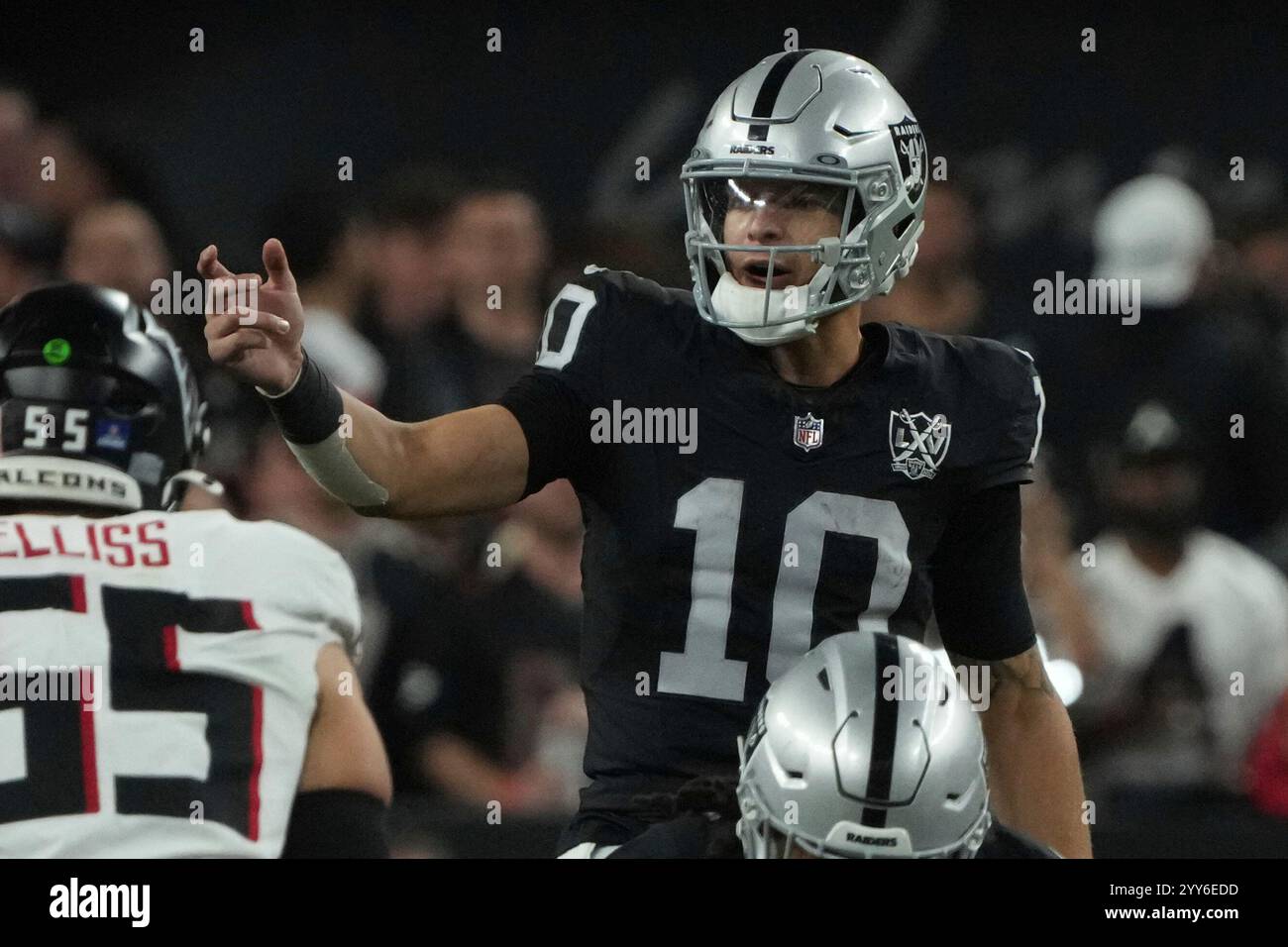 Las Vegas Raiders quarterback Desmond Ridder (10) lines up against the