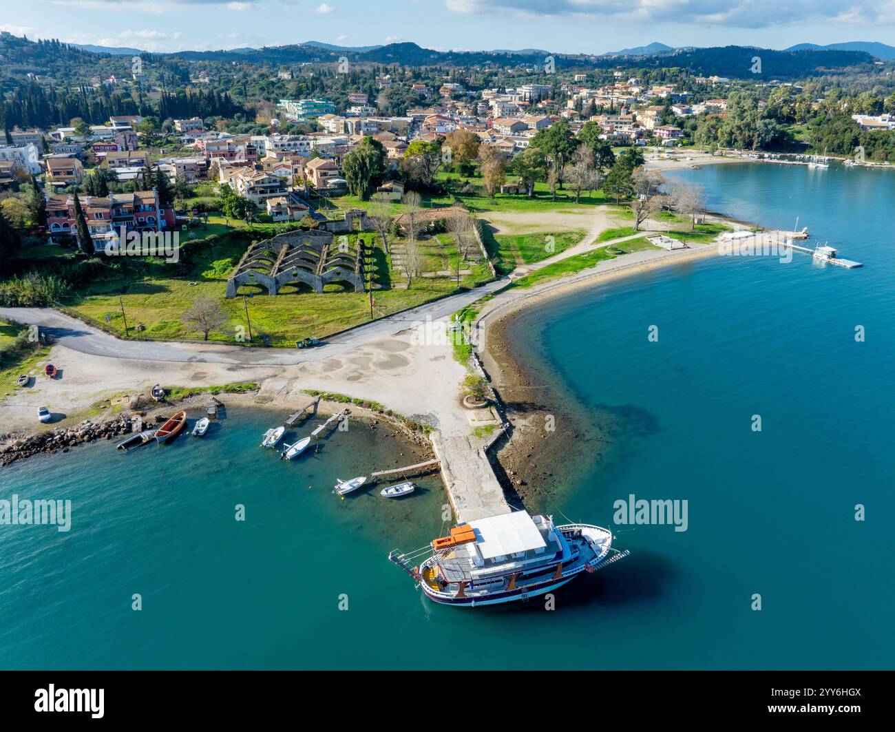 Aerial view of coastal town, harbor, and moored boat Stock Photo - Alamy
