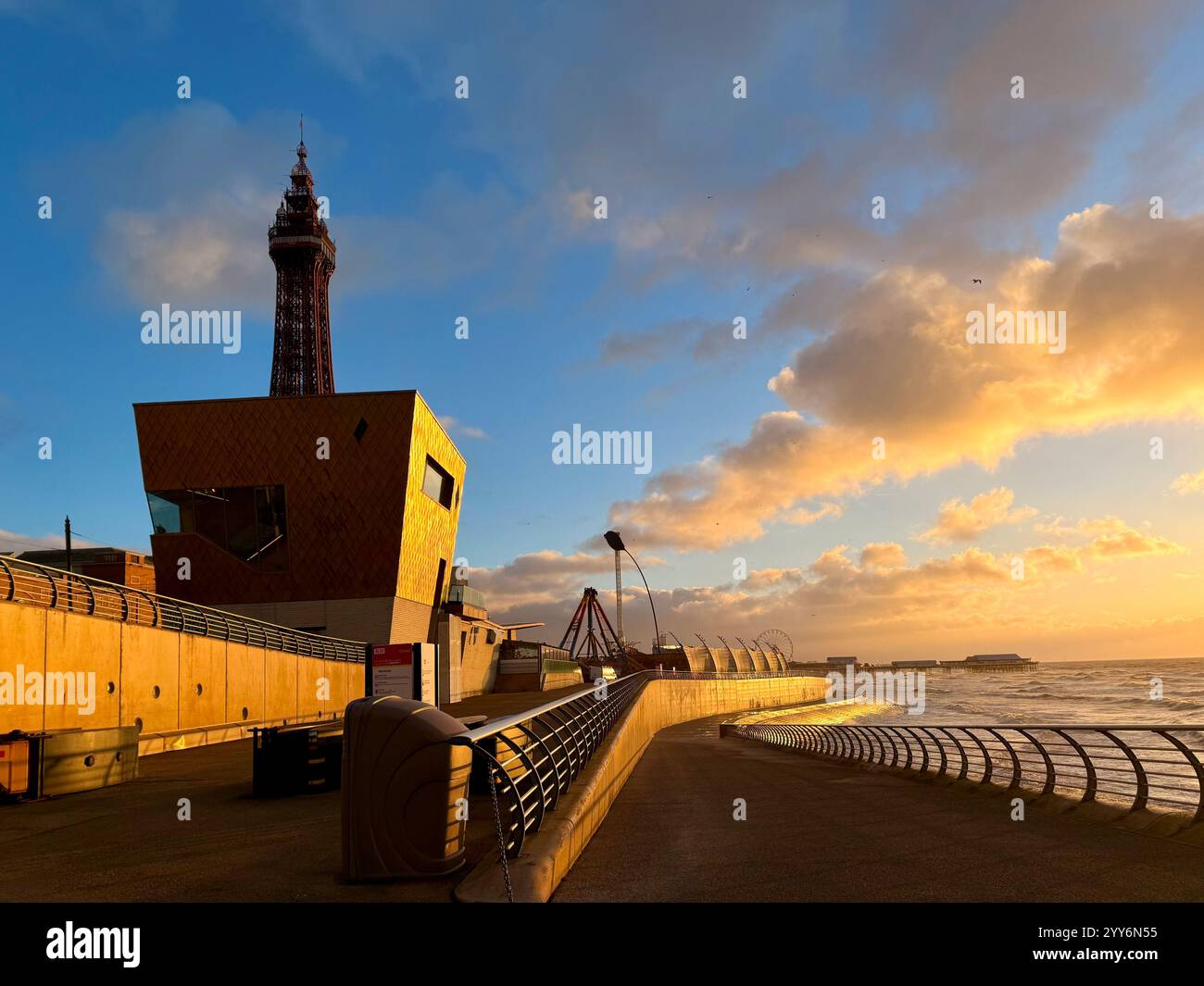 Blackpool Tower and Golden wedding chapel on the seafront at Blackpool. Winter evening light on the promenade with Central Pier in the distance - Smartphone Captured Stock Image