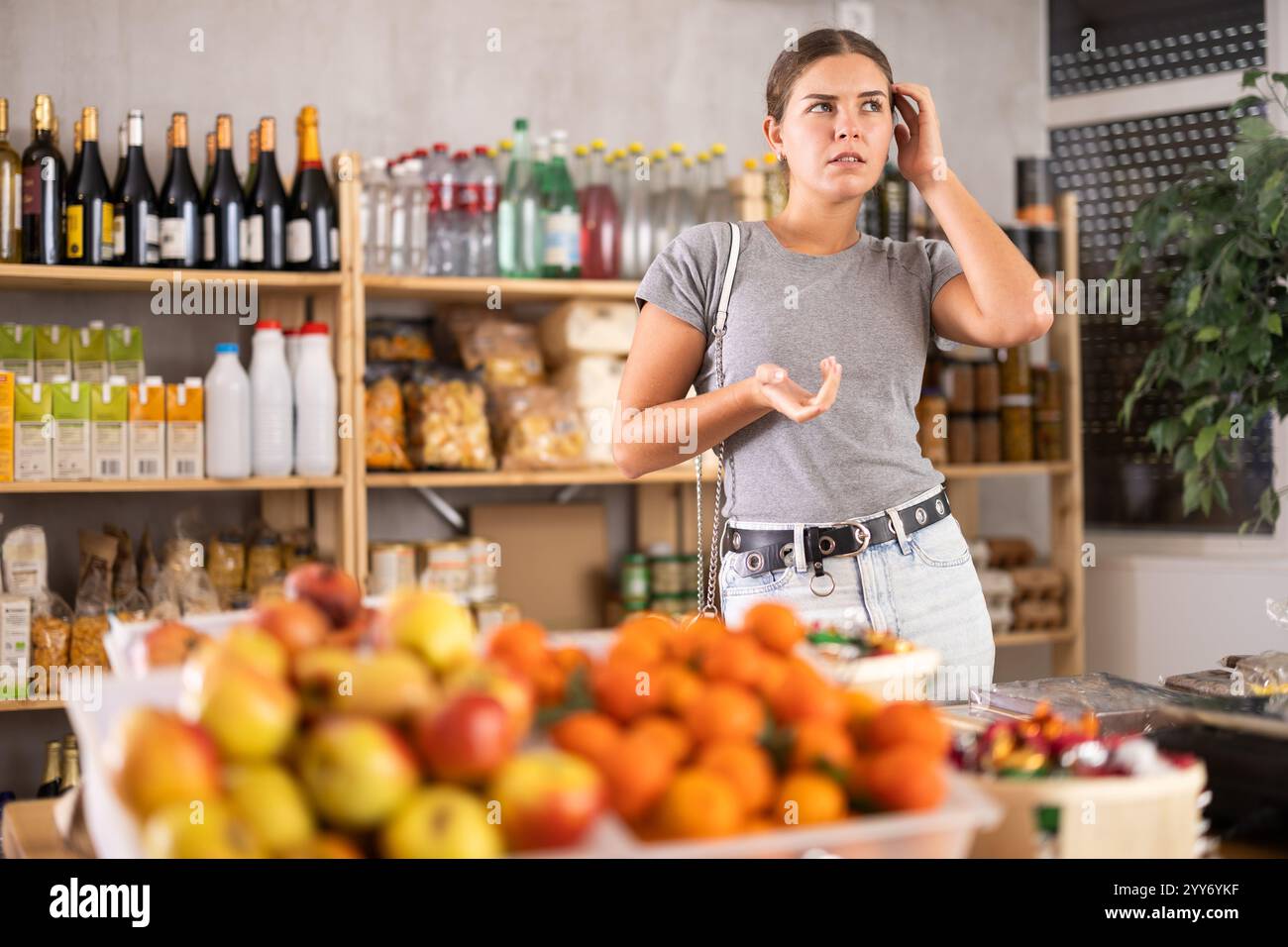 Woman confused in supermarket hi-res stock photography and images - Alamy