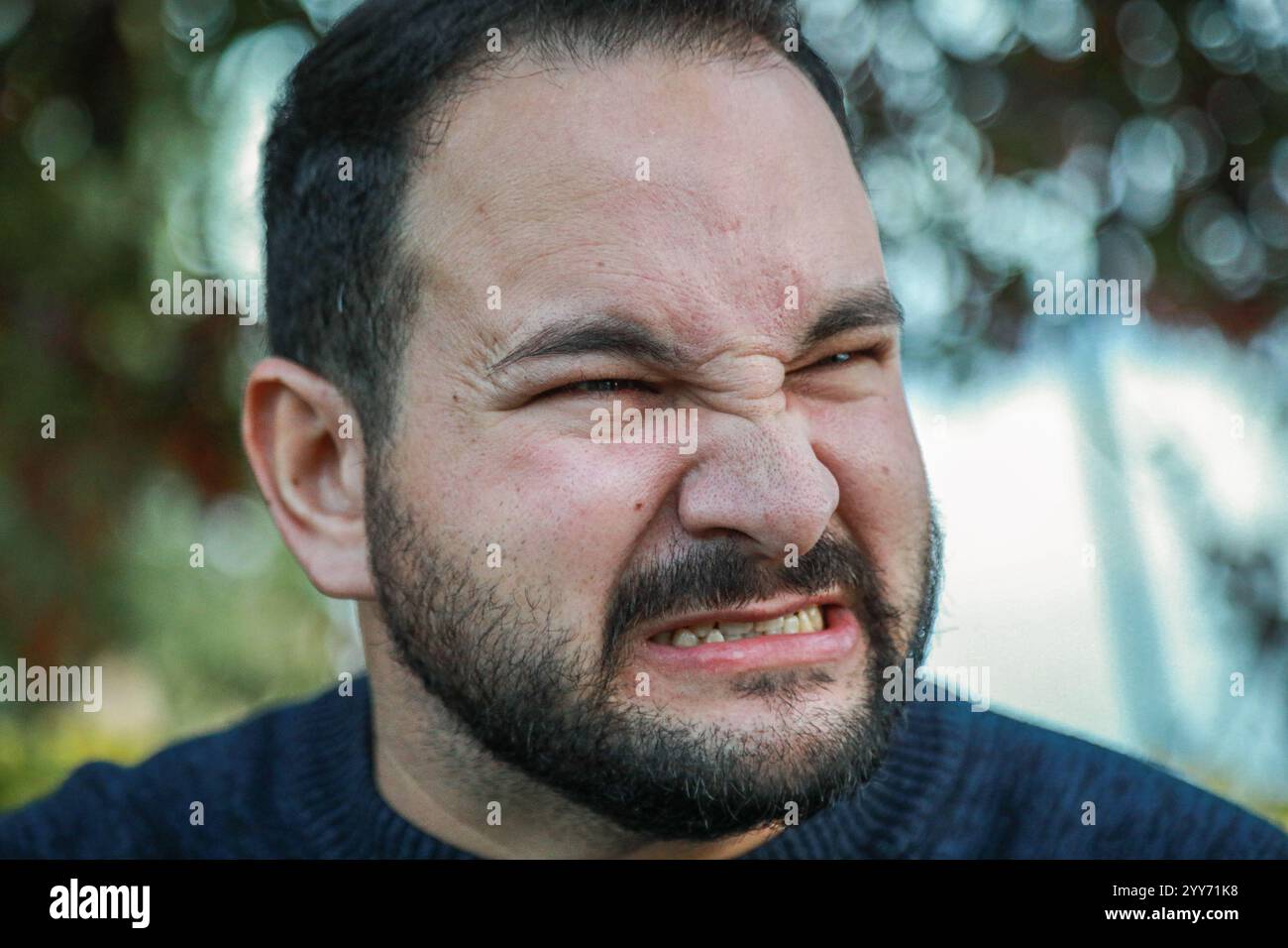 Man Reacts to Intense Lemon Sourness Stock Photo