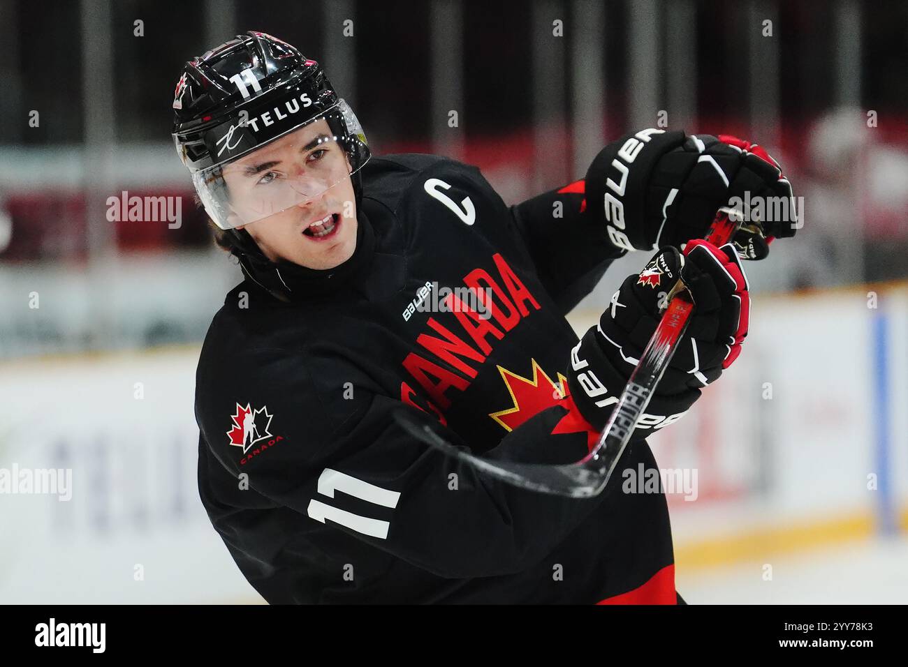 Canada's Brayden Yager (11) shoots during warmup prior to IIHF World