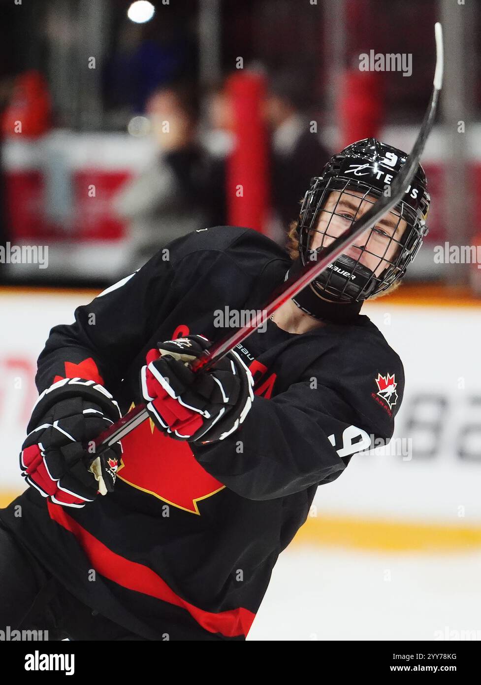 Canada's Gavin McKenna (9) shoots during warmup prior to IIHF World