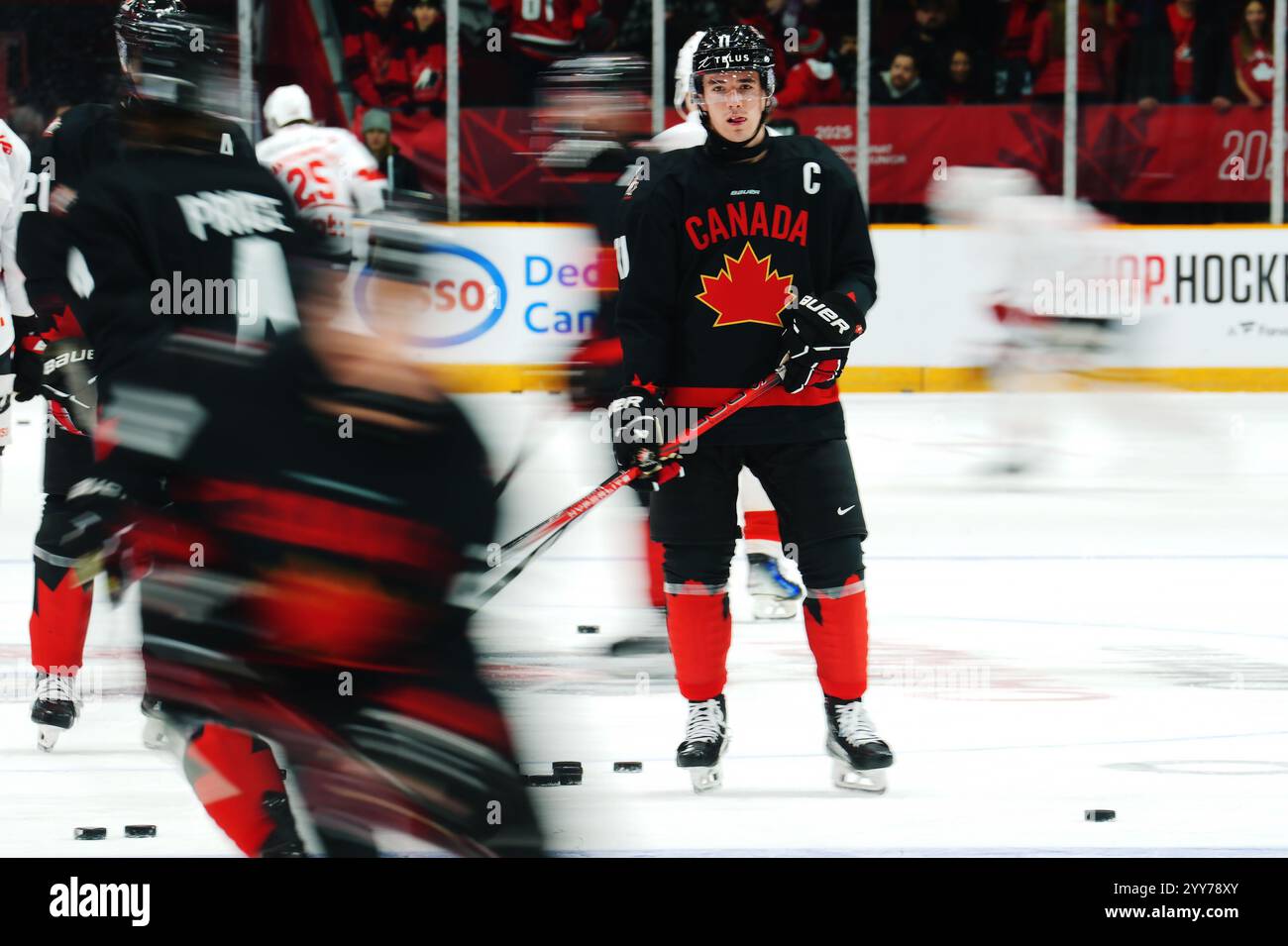 Canada's Brayden Yager (11) looks on during warmup prior to IIHF World