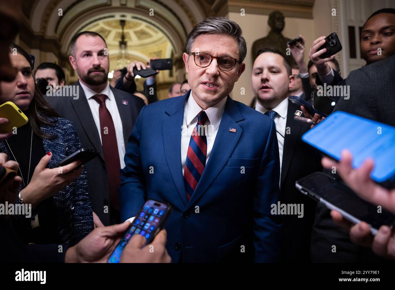 House Speaker Mike Johnson (R-La.) speaks with reporters as he emerges ...