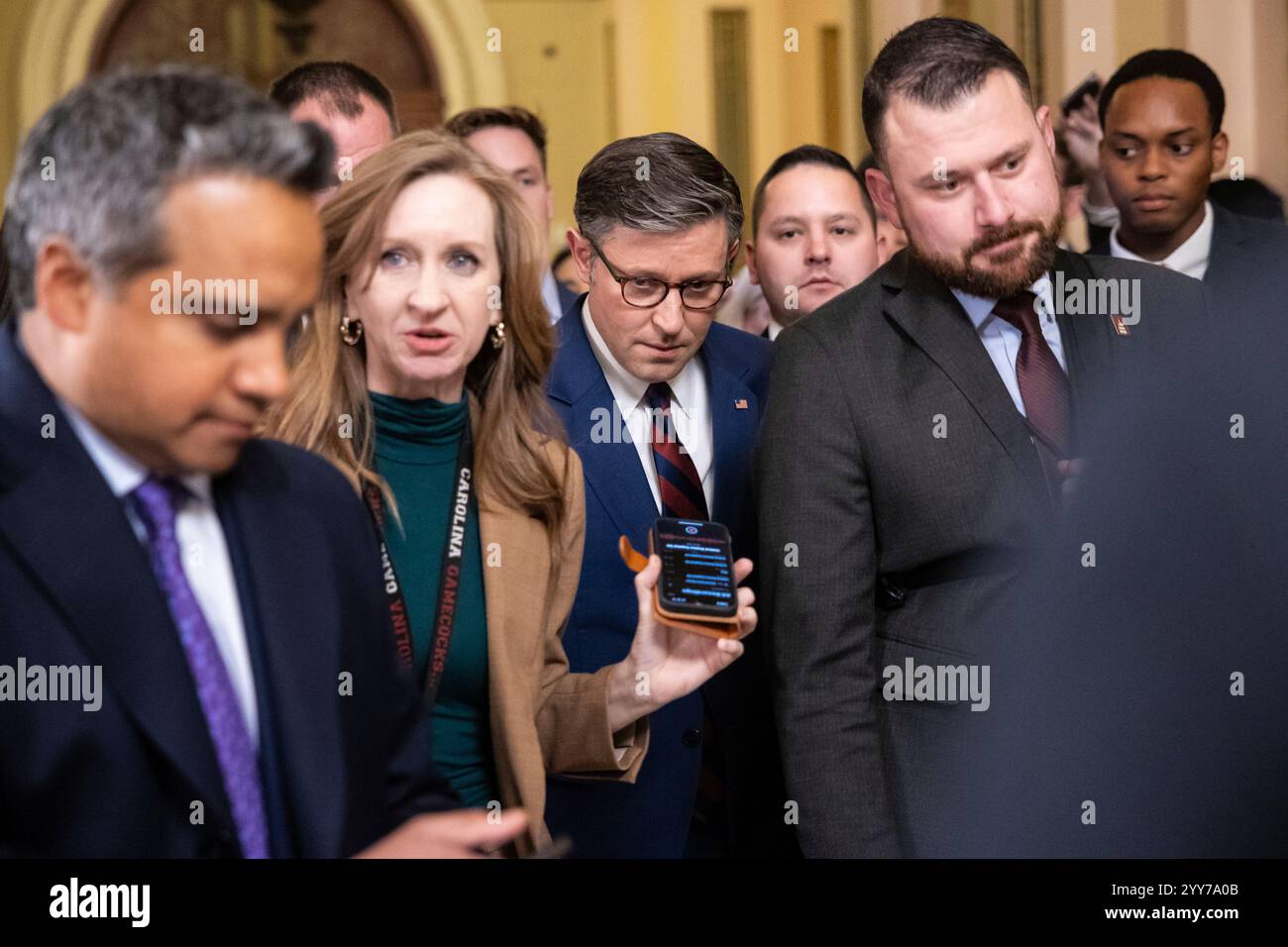 House Speaker Mike Johnson (R-La.) speaks with reporters as he emerges ...