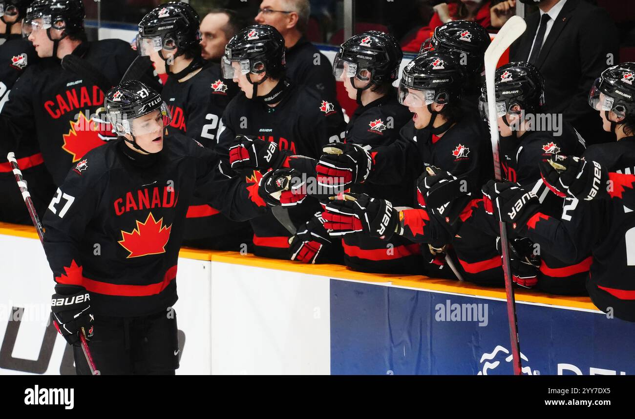 Canada's Easton Cowan (27) celebrates his goal against Switzerland