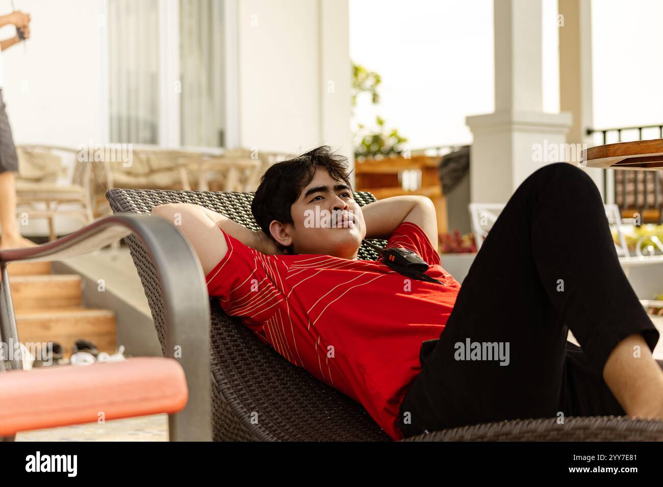 Relaxed man sitting on armchair hi-res stock photography and images - Alamy