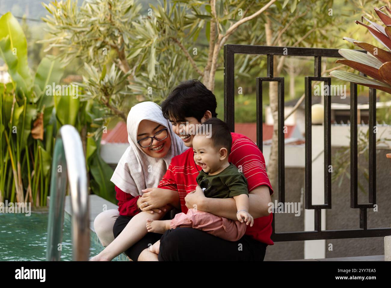 Happy Asian Family Smiling Together. Small Family Sharing Laughter Together Stock Photo