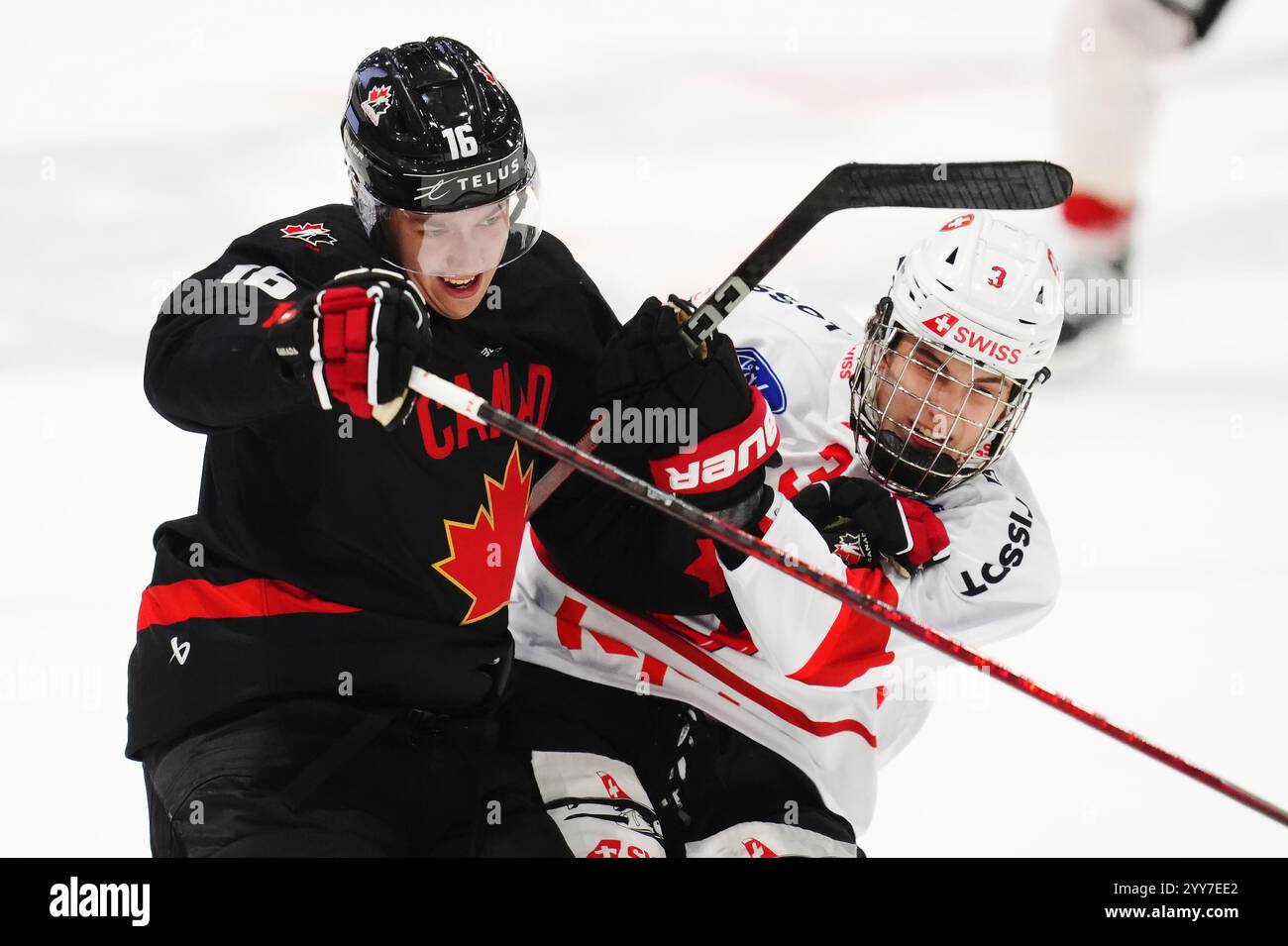 Canada's Carson Rehkopf (16) battles with Switzerland's Jonah