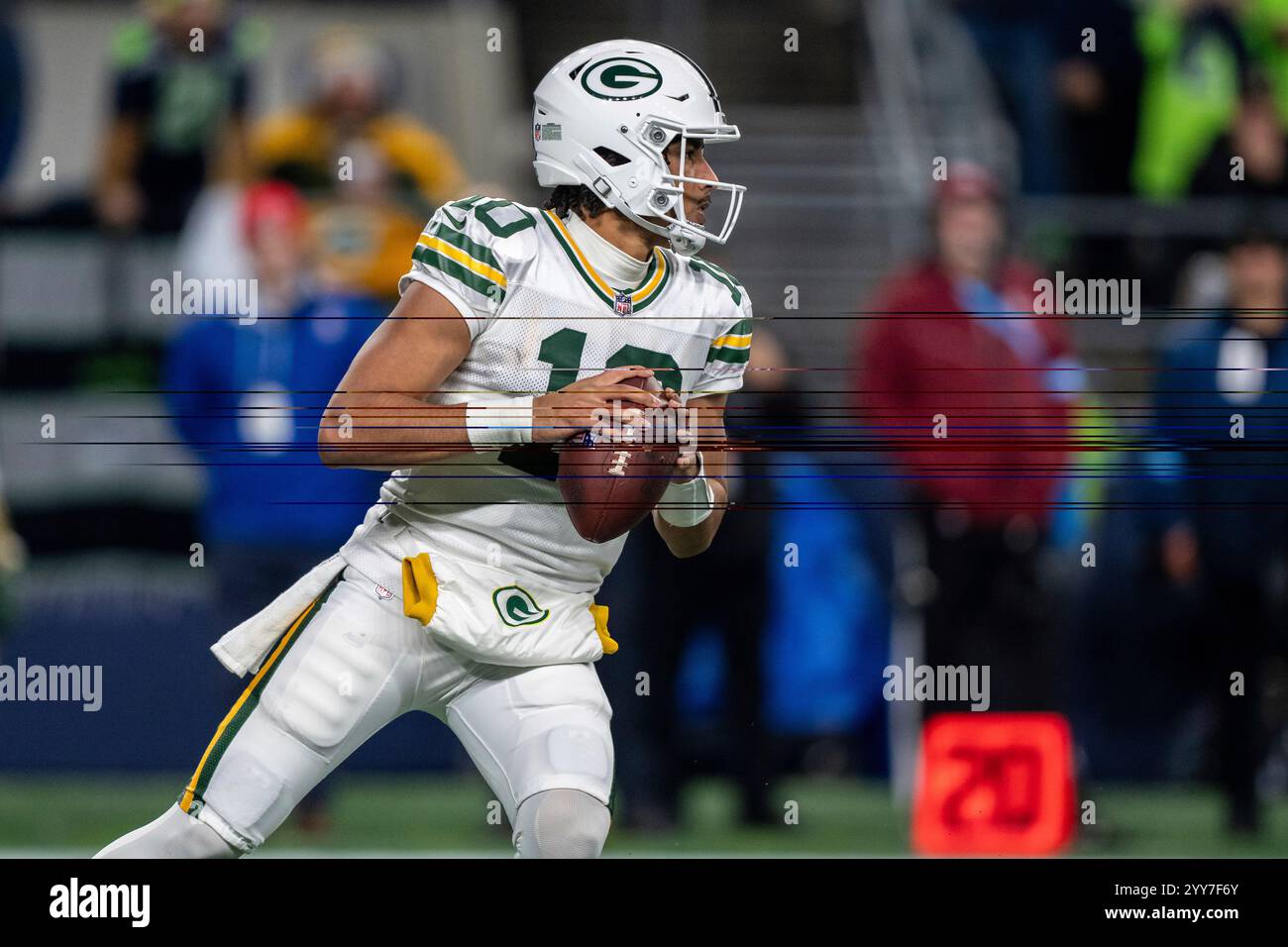 Green Bay Packers quarterback Jordan Love drops back to pass during n