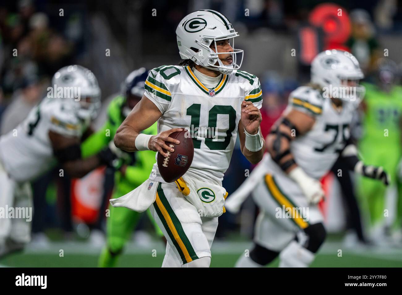 Green Bay Packers quarterback Jordan Love looks to pass dudring an NFL
