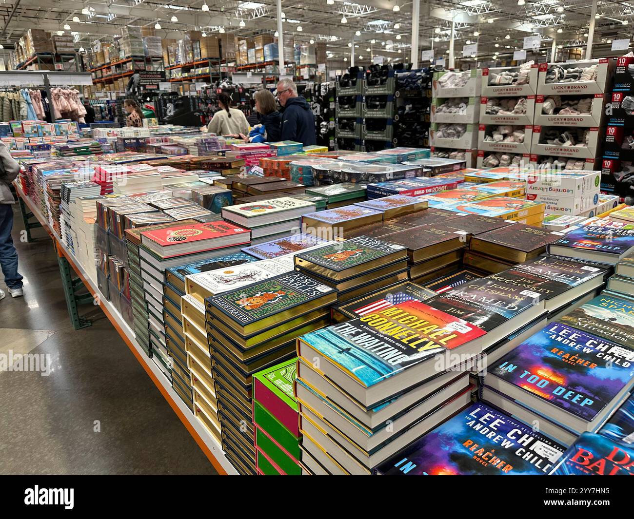 Shoppers peruse books on display in a Costco warehouse Thursday, Dec ...