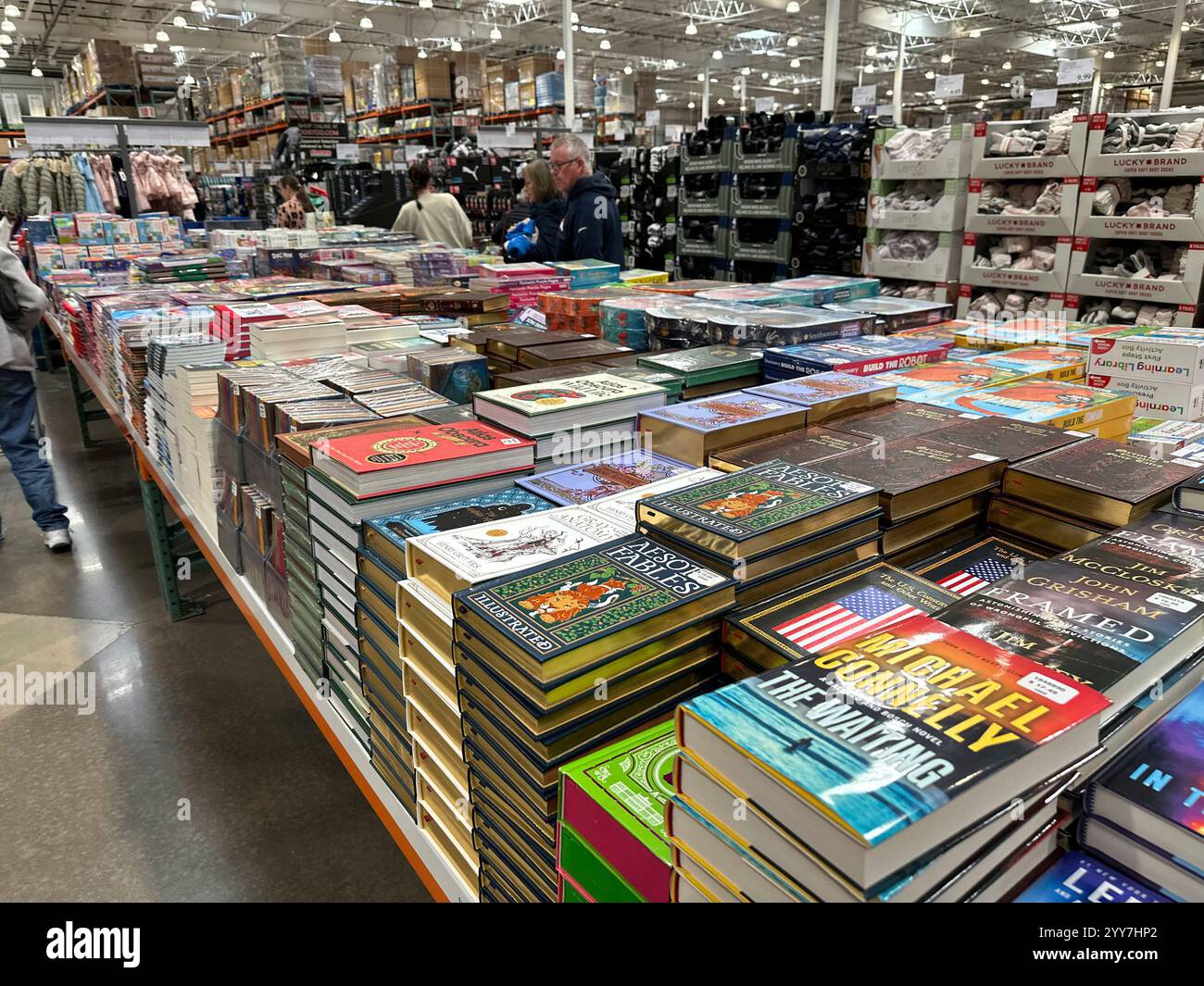Shoppers peruse books on display in a Costco warehouse Thursday, Dec ...