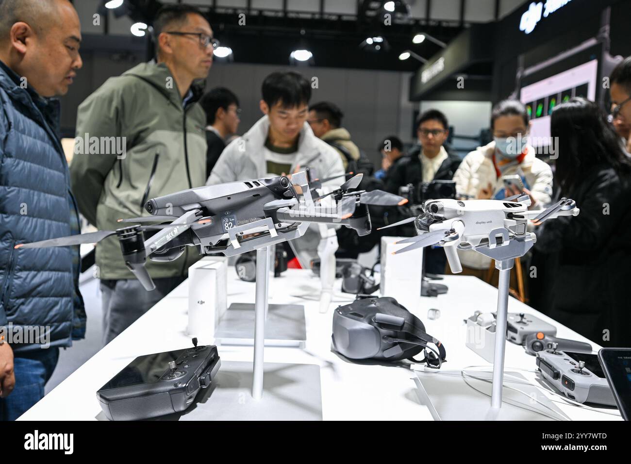 Visitors visit DJI drones at the World Intelligent Manufacturing Expo