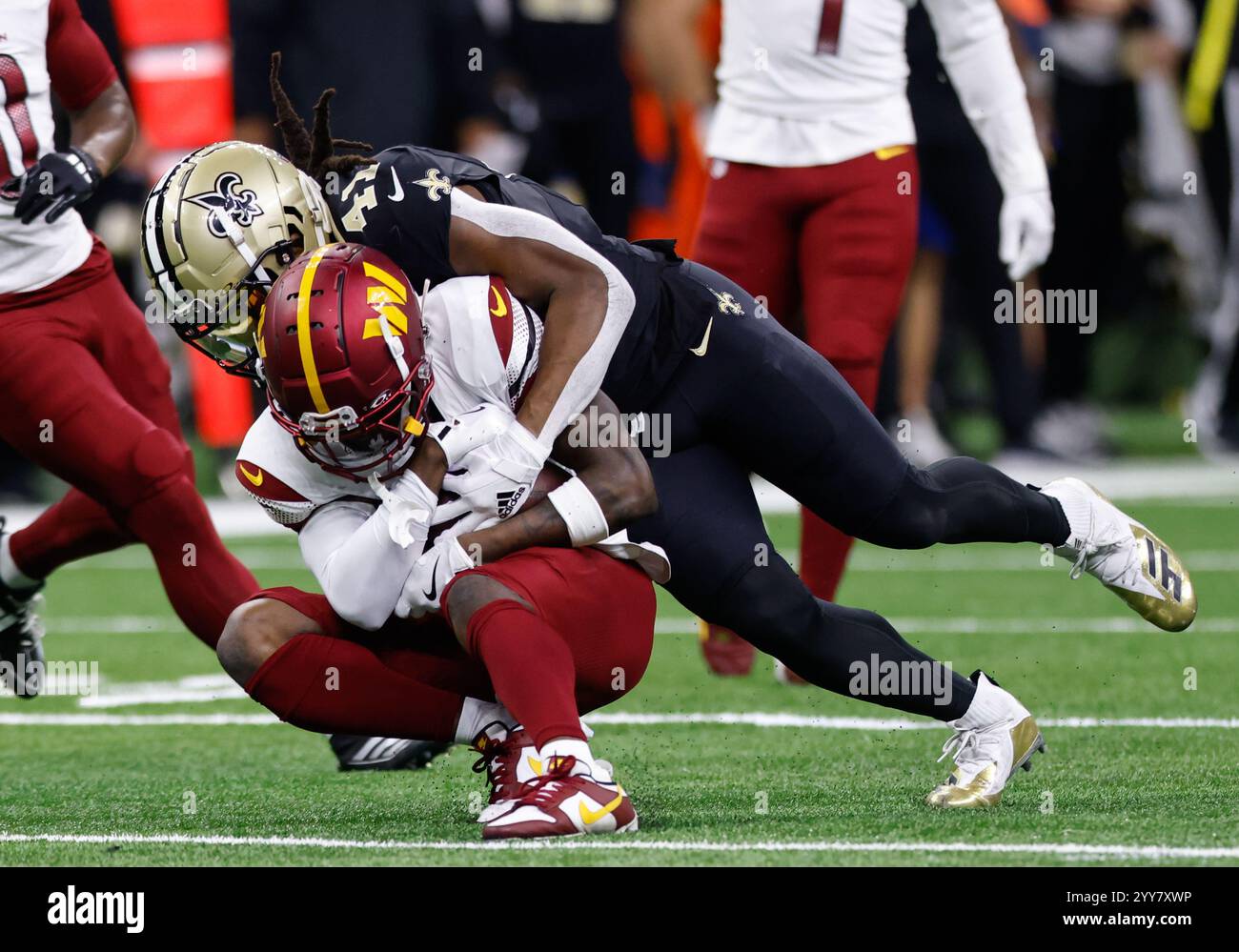 Washington Commanders cornerback Mike Sainristil (0) with the