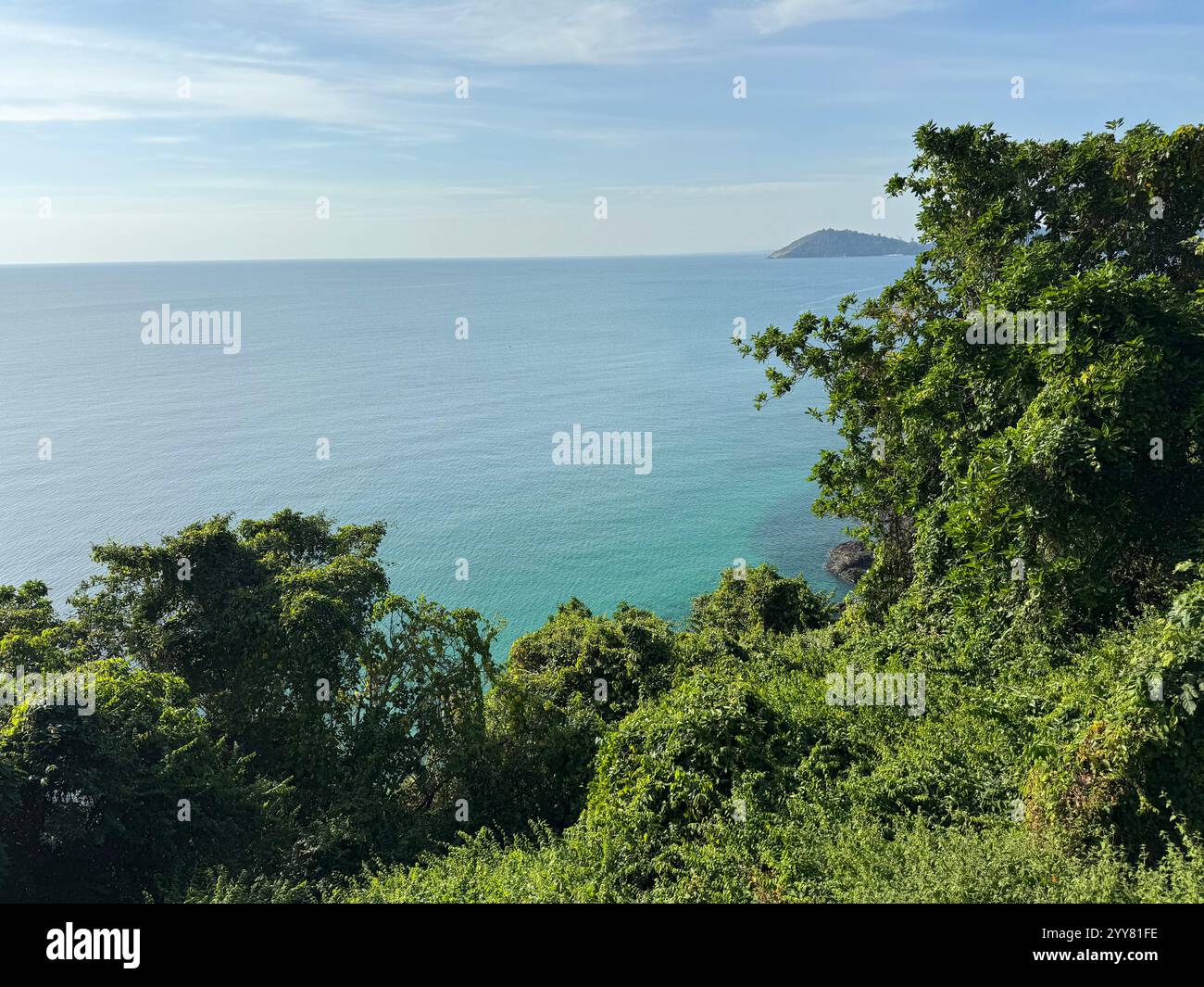 View of the colorful ocean above tropical greenery in the Gulf of Thailand - Smartphone Captured Stock Image