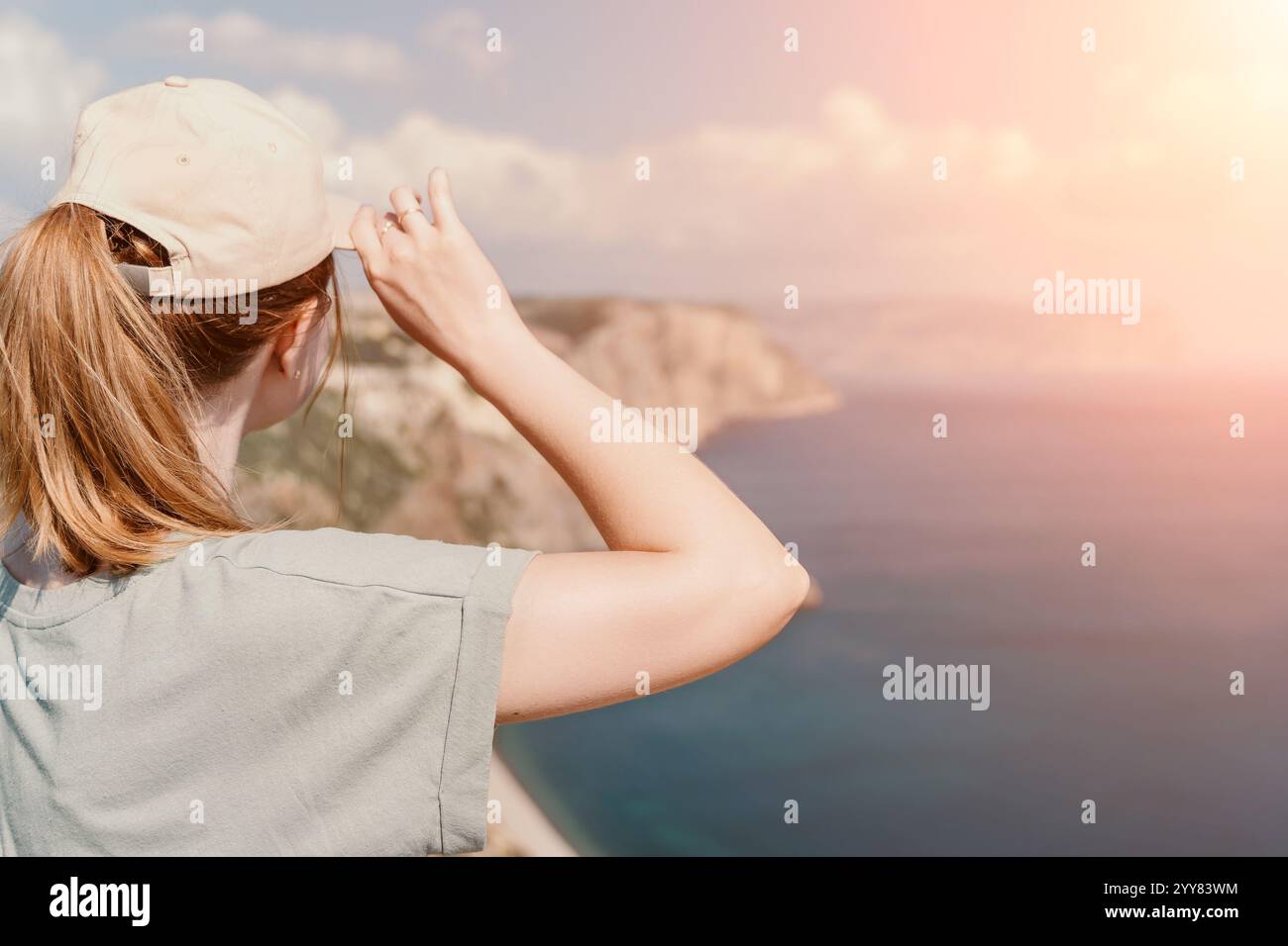 Woman in cap gazing hi-res stock photography and images - Alamy