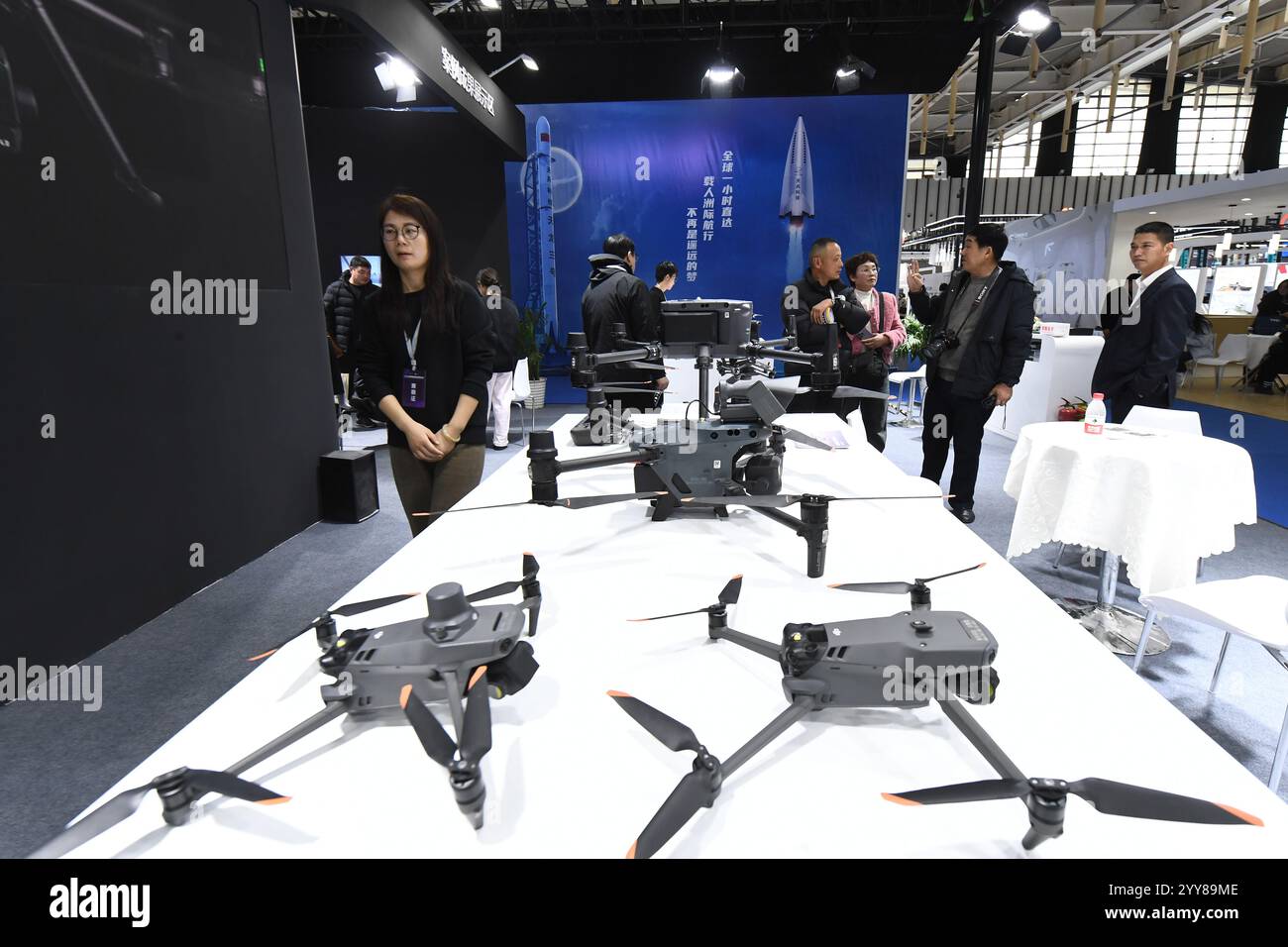 NANJING, CHINA DECEMBER 20, 2024 People visit a DJI drone on