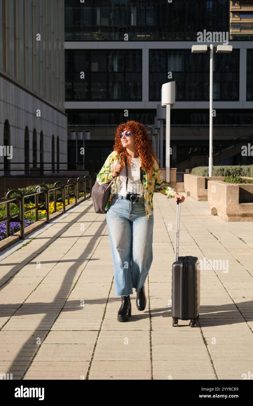 Redhead woman tourist walking hi-res stock photography and images - Alamy