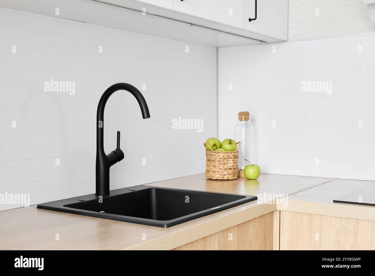Introducing a modern black kitchen sink and faucet that features a