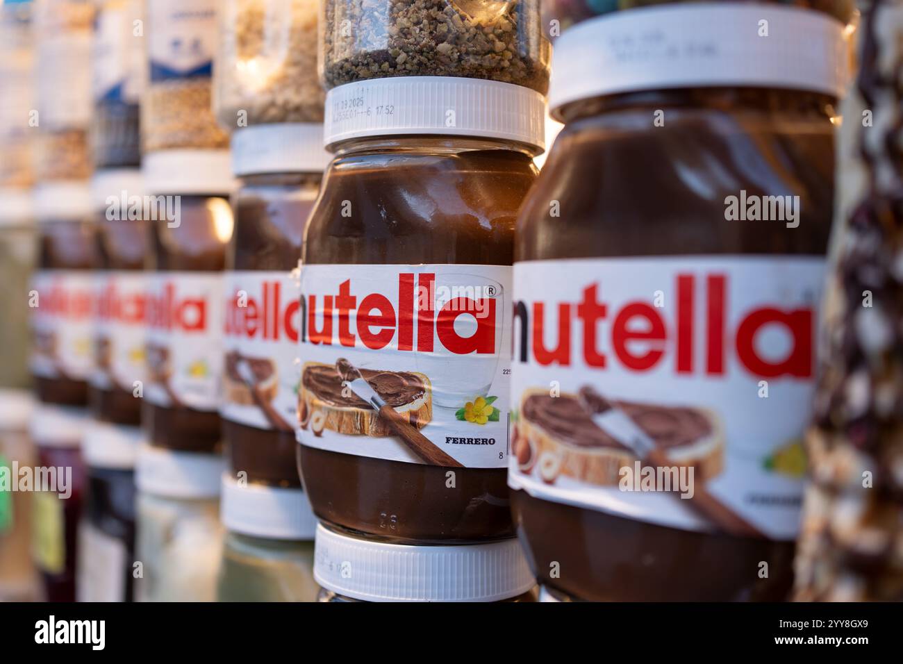 Close-up view of Nutella jars displayed on a store shelf. The iconic brand by Ferrero is widely recognized for its chocolate hazelnut spread. Stock Photo