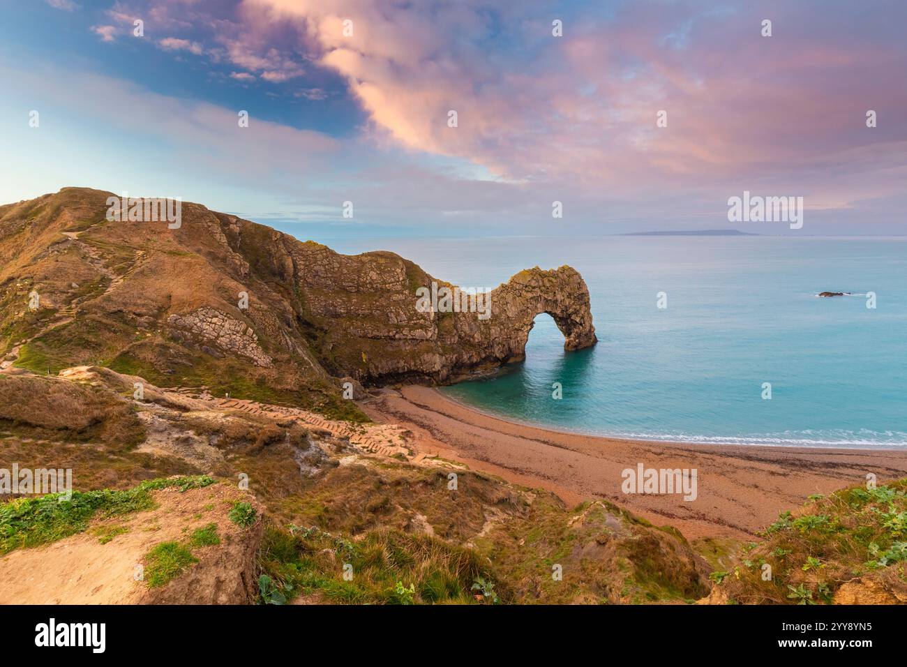 Aerial view at sunset of the Durdle Door, a natural limestone arch on the Jurassic Coast near Lulworth in Dorset, Southern England. Stock Photo