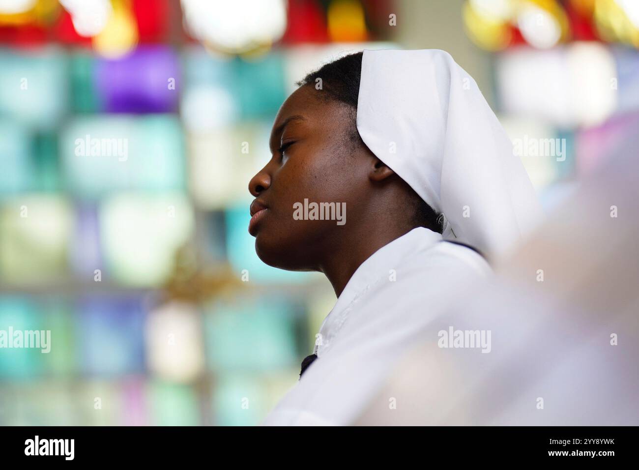 Sister Seyram Mary Adzokpa of the Sisters of the Holy Family prays the