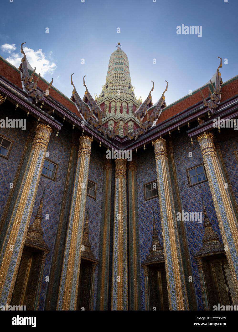 Wat Phra Kaew in Bangkok, Thailand—a masterpiece of Thai architecture. This sacred temple is adorned with intricate gold details, vibrant patterns, an Stock Photo