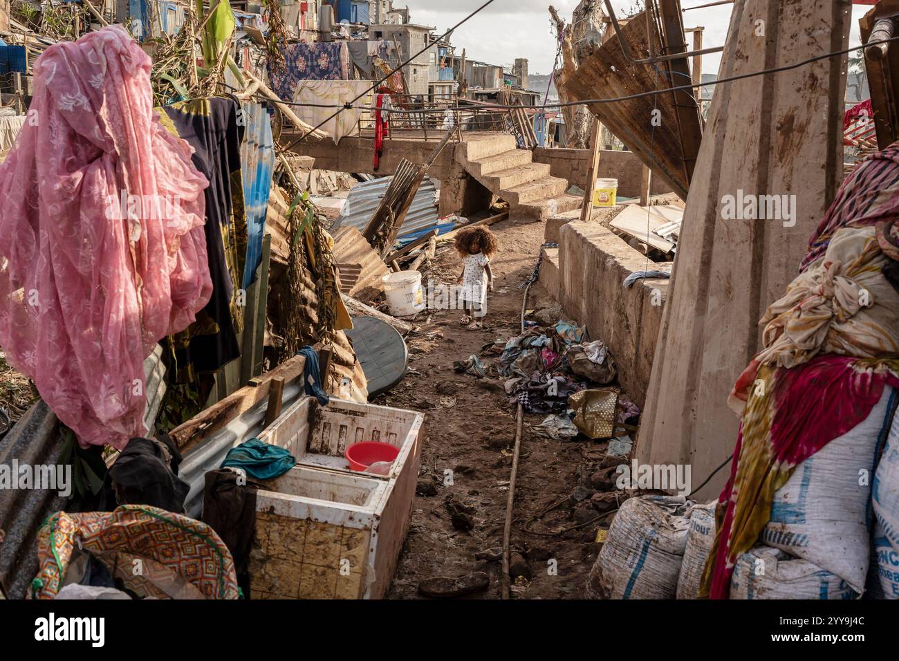 A young girl walks in the Kaweni slum on the outskirts of Mamoudzou, in