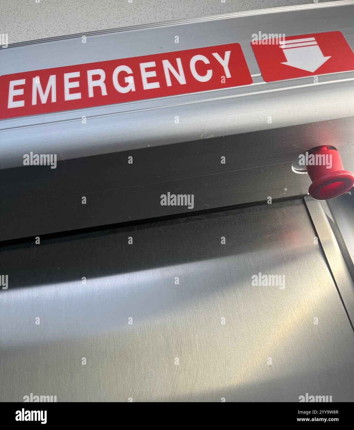 emergency button, emergency knob, emergency release, emergency exit, safety, public bathroom, public restroom, public toilet, safety release - Smartphone Captured Stock Image