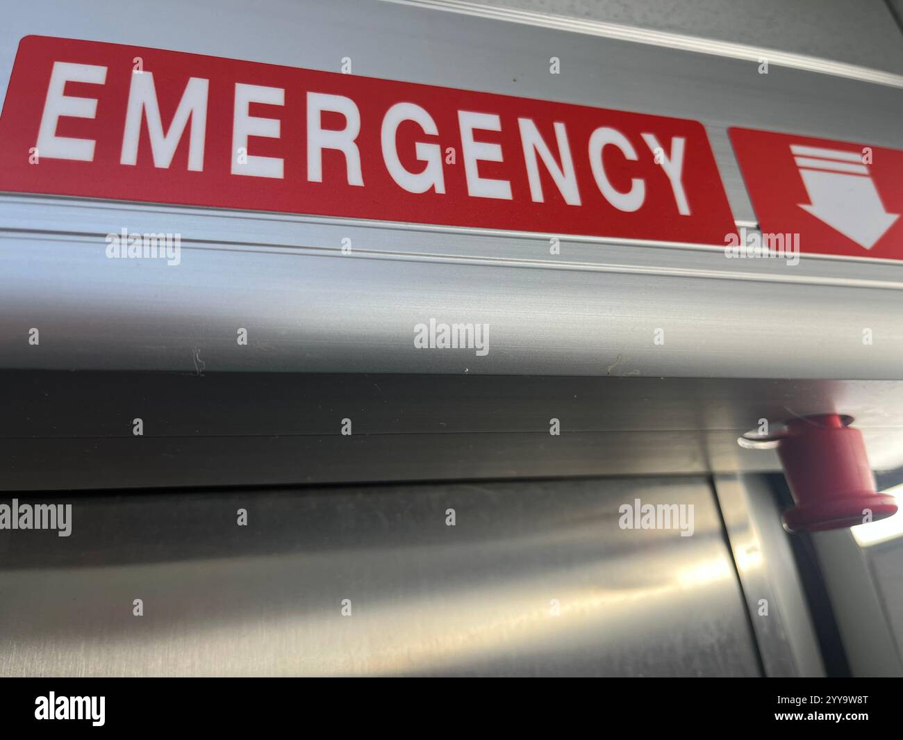 emergency button, emergency knob, emergency release, emergency exit, safety, public bathroom, public restroom, public toilet, safety release - Smartphone Captured Stock Image