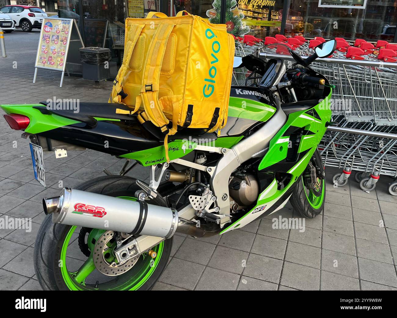 Glovo, food delivery motorbike, food delivery motorcycle, occupation, occupations - Smartphone Captured Stock Image
