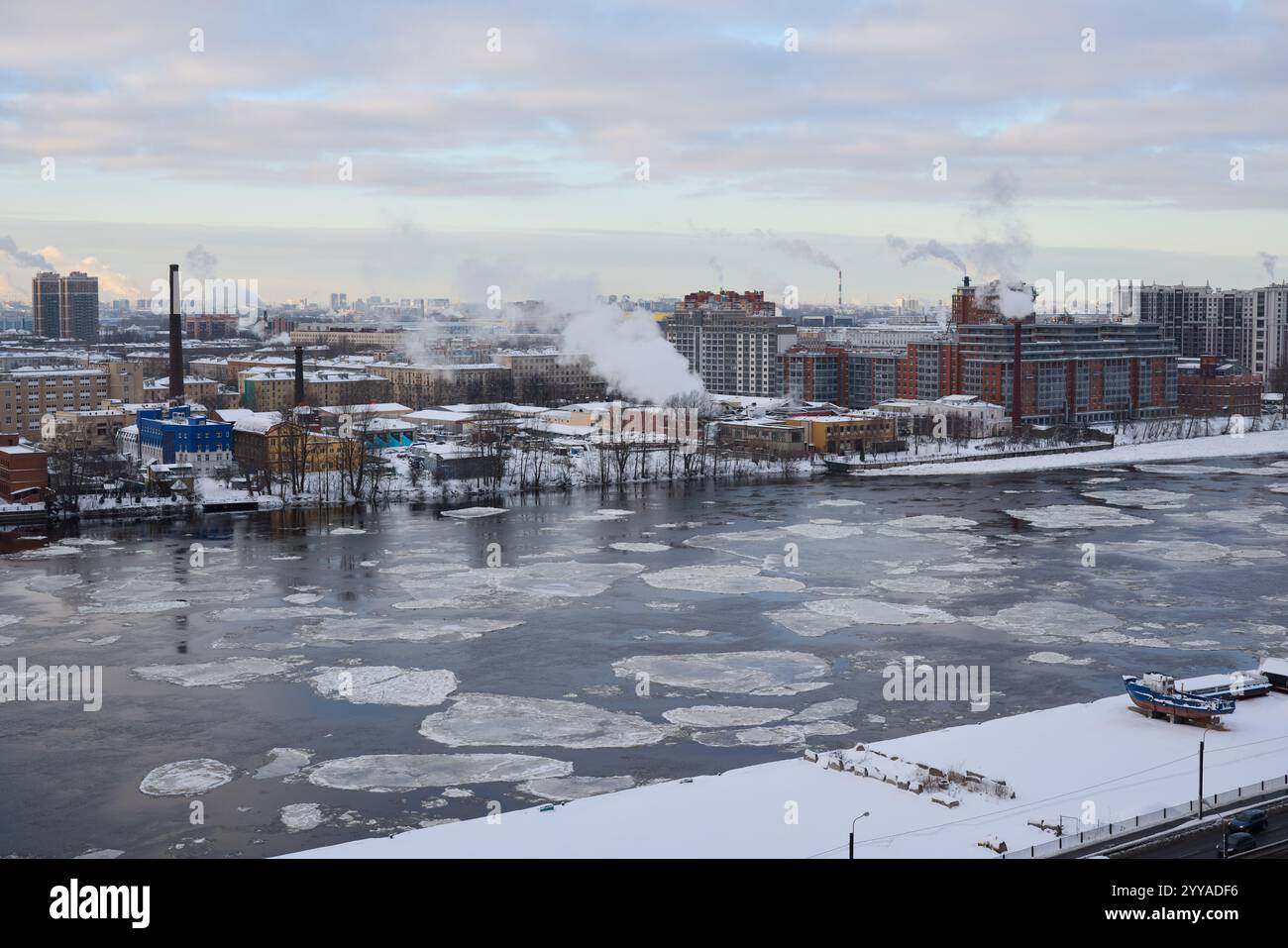 A peaceful and serene winter scene captures a river beautifully adorned ...
