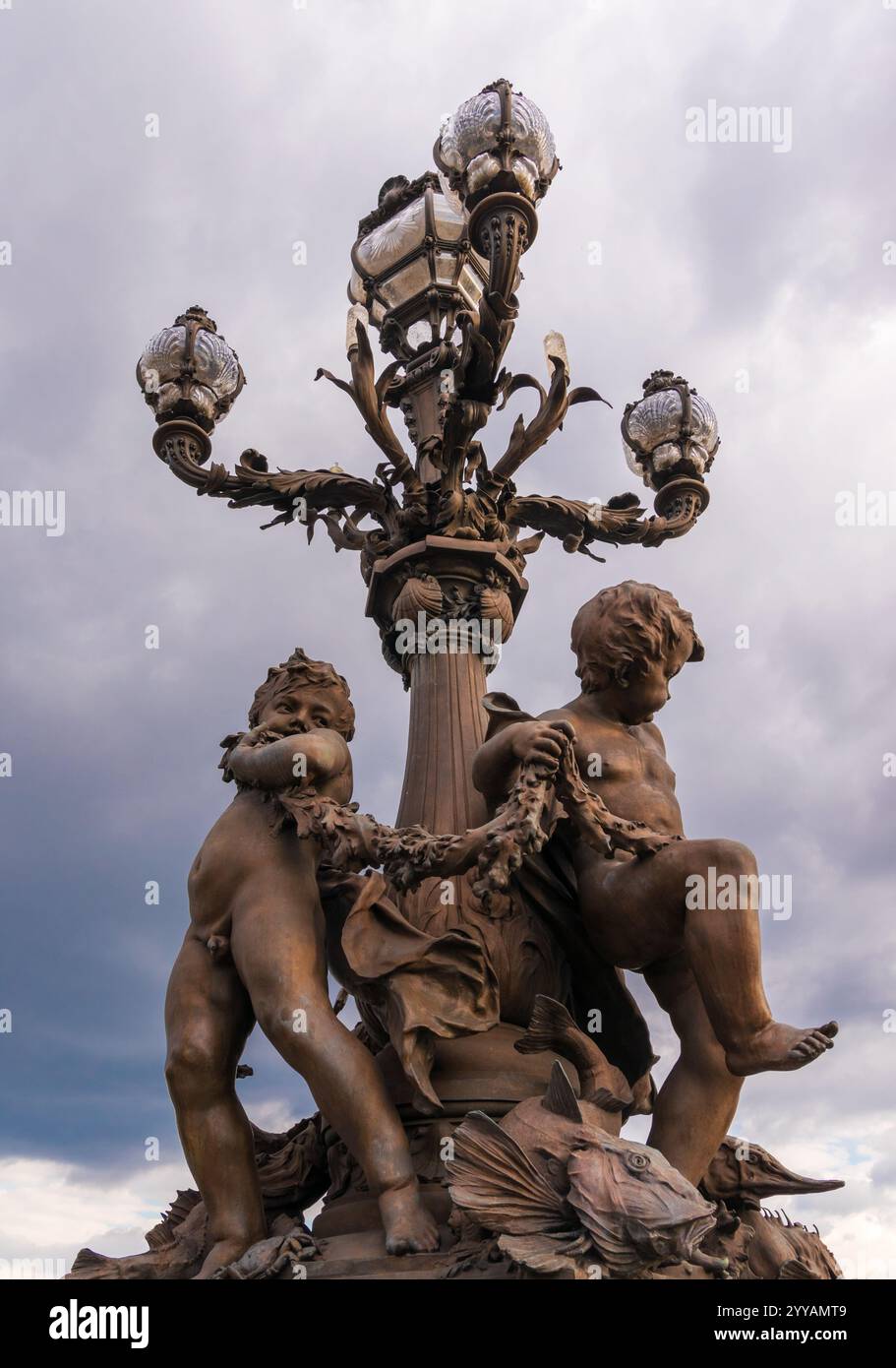 Lamp post on the Alexandre III bridge in Paris, France Stock Photo