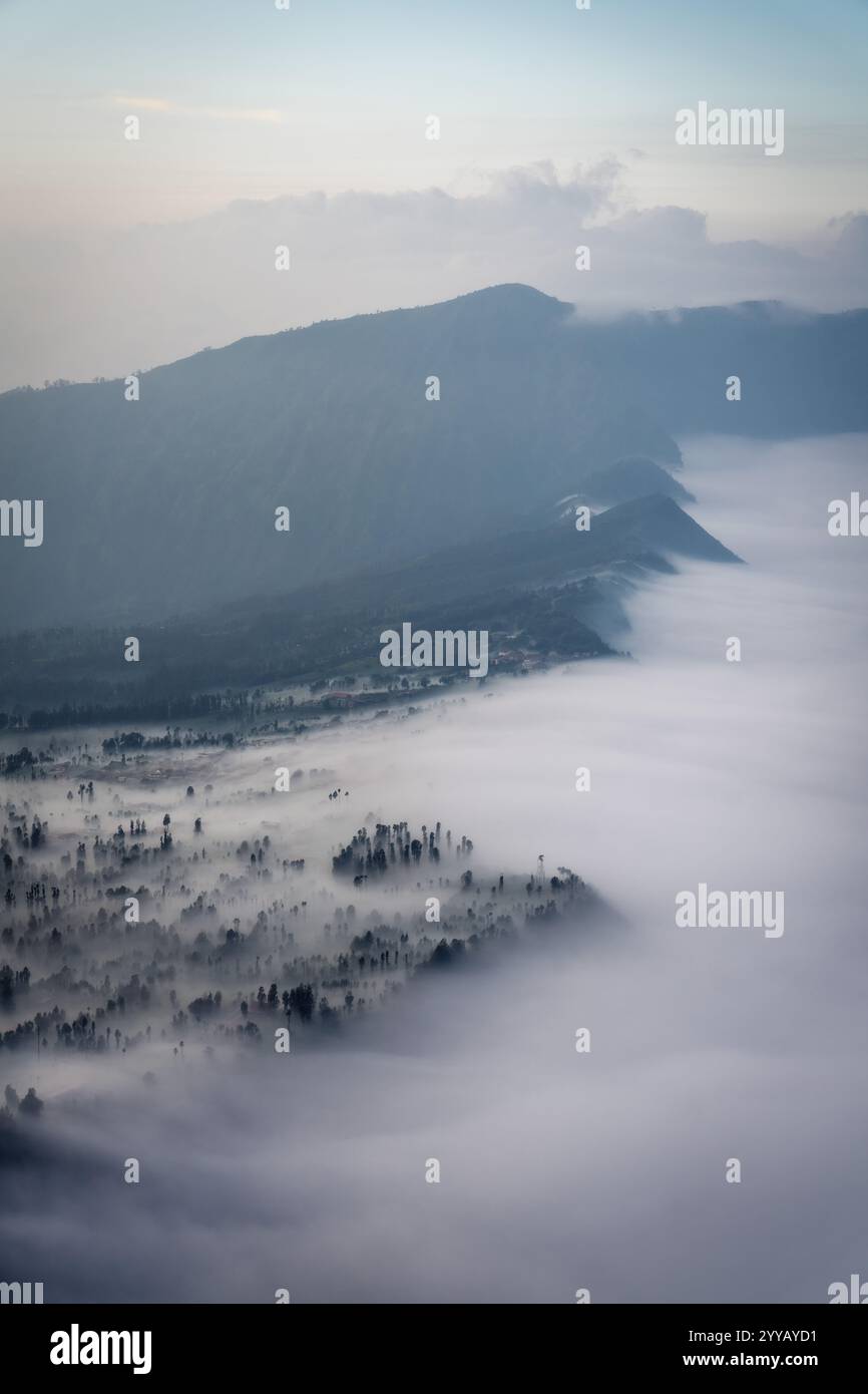 Low Clouds rolling in over mountain ridge Stock Photo