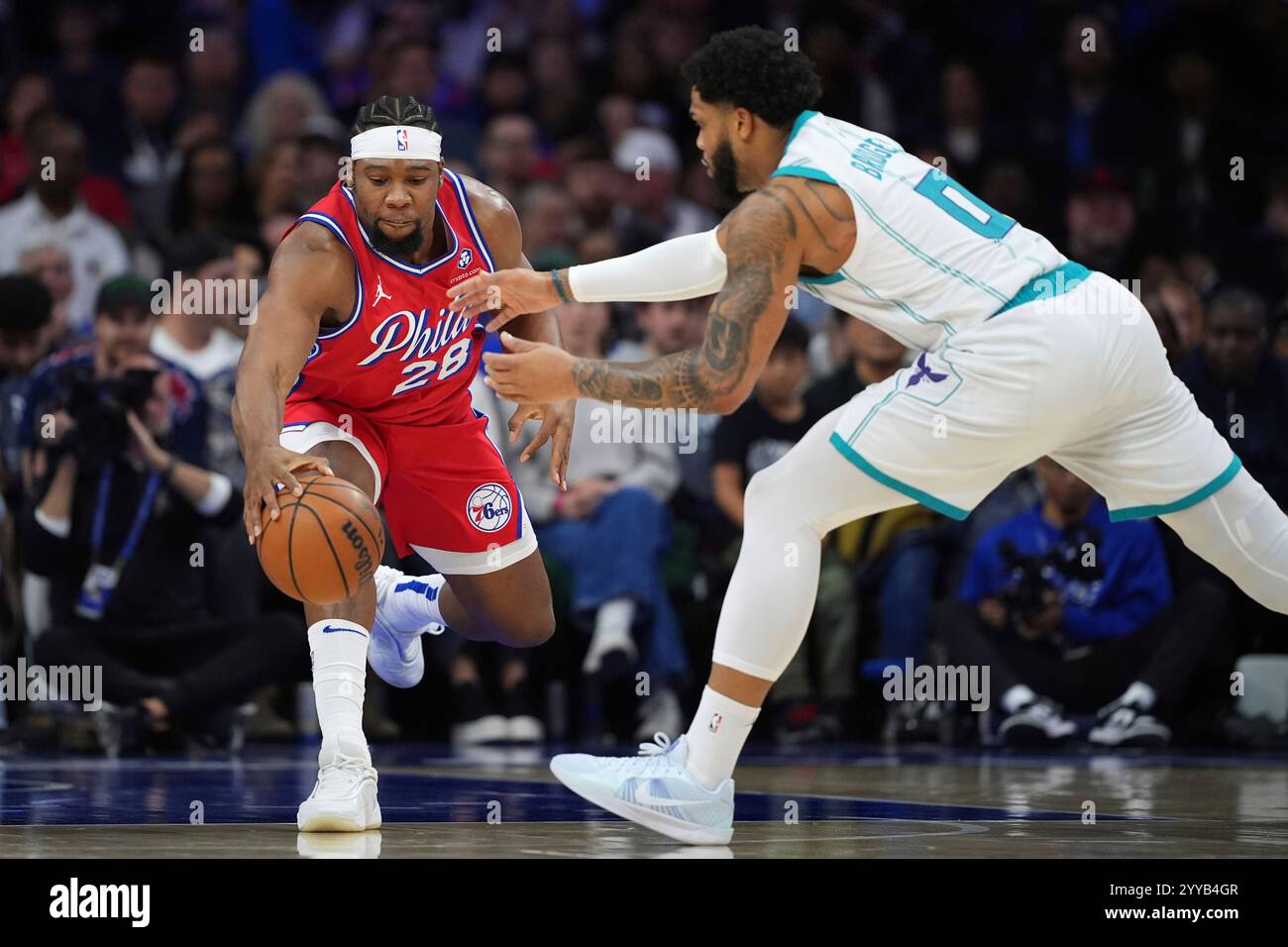 Philadelphia 76ers' Guerschon Yabusele, left, and Charlotte