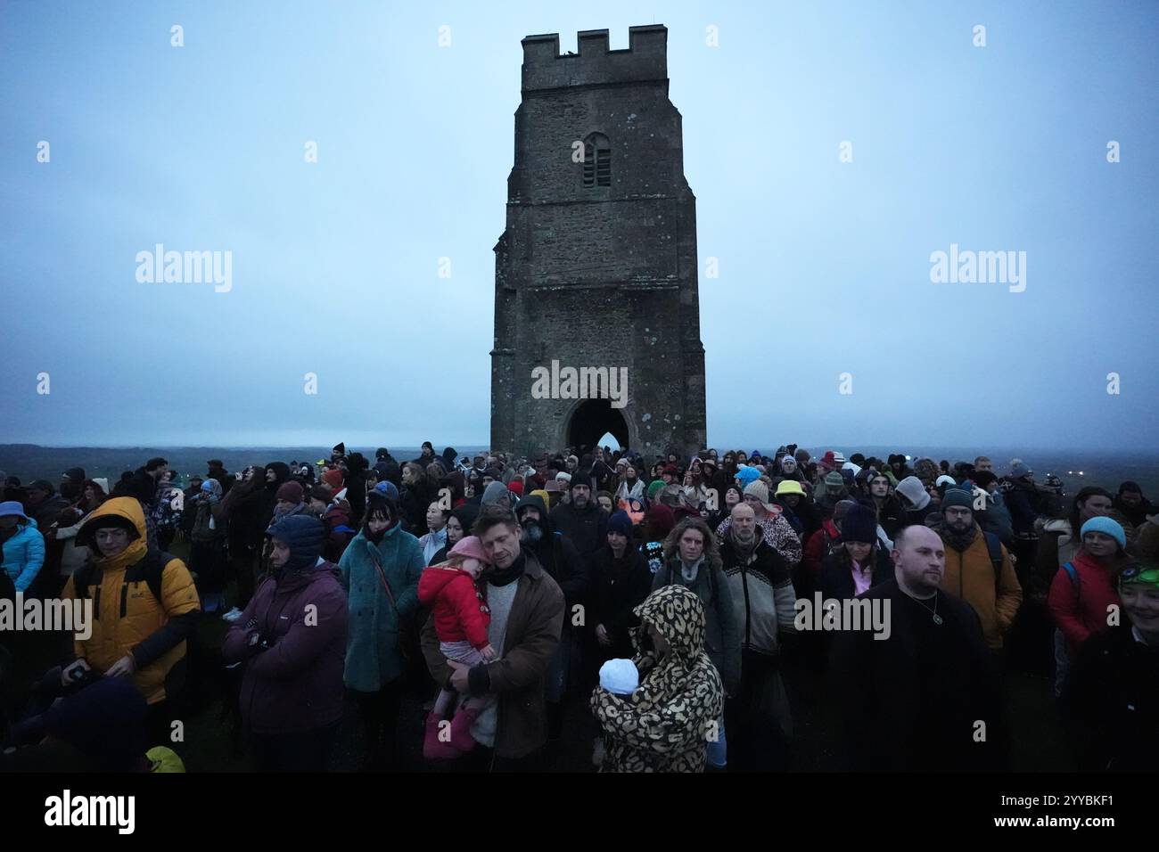 People take part in the winter solstice celebrations during sunrise at