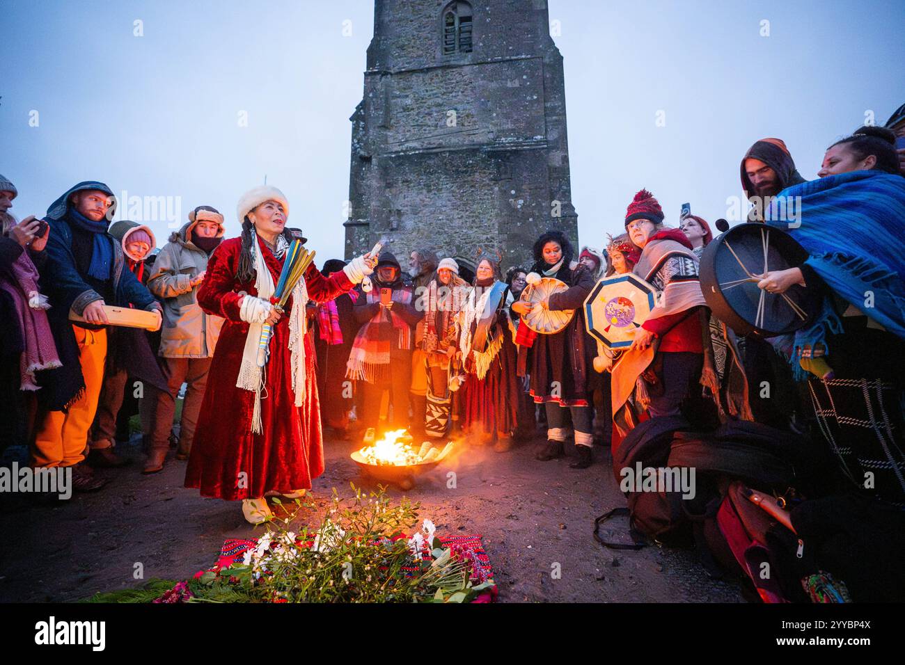 People take part in the winter solstice celebrations during sunrise at