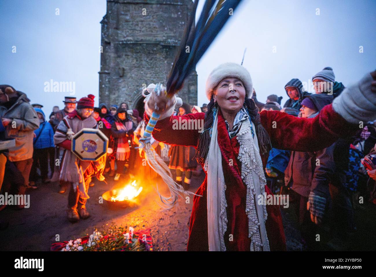 People take part in the winter solstice celebrations during sunrise at