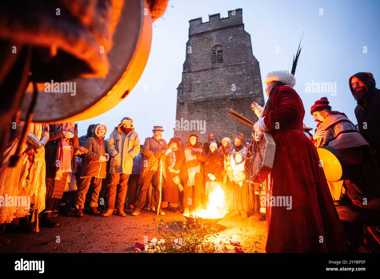 People take part in the winter solstice celebrations during sunrise at