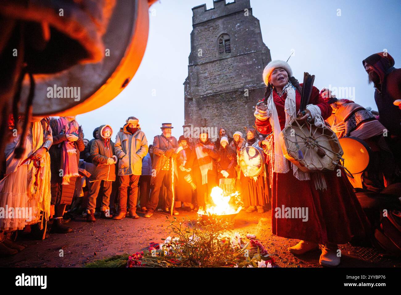 People take part in the winter solstice celebrations during sunrise at